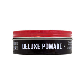UPPERCUT DELUXE pomade on hand demonstrating easy warming and even application benefit