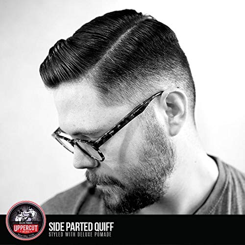 UPPERCUT DELUXE combing a clean side part to show precise control and polished finish