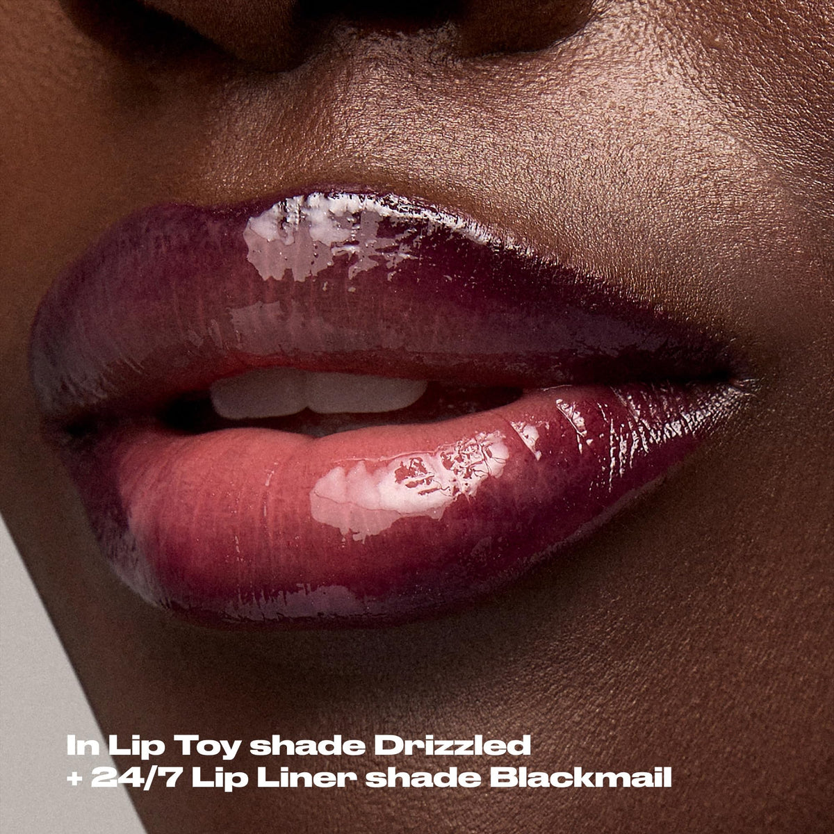 Urban Decay lip oil next to coin showing compact travel-friendly size