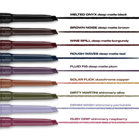 Urban Decay eyeliner held in hand showing compact, travel-friendly size