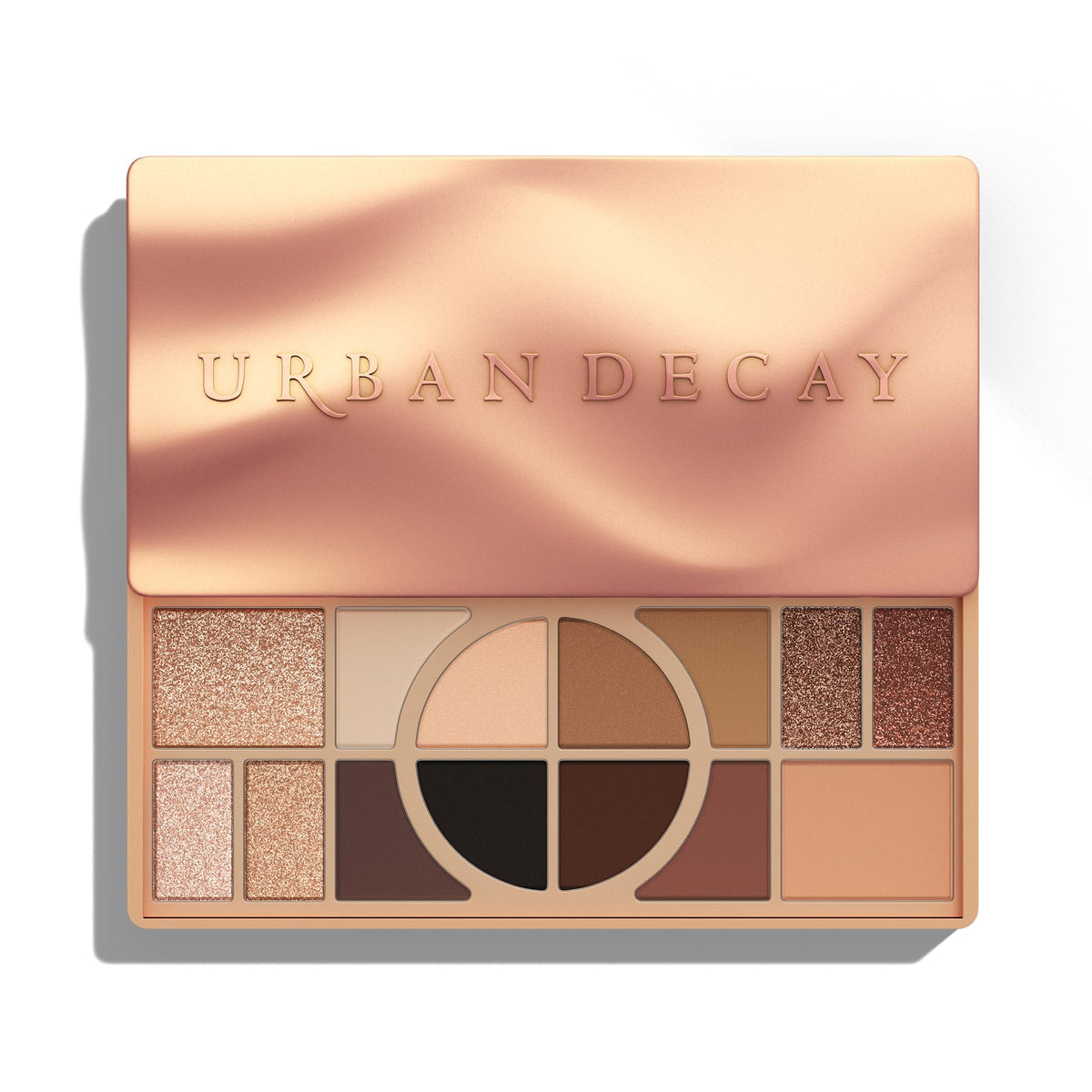 Urban Decay palette open showing 14 warm shades for versatile looks