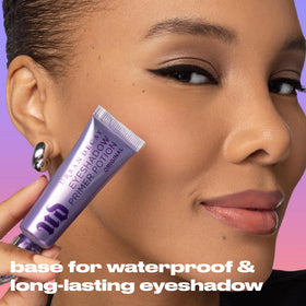 Urban Decay travel-size primer inside a small makeup bag for portability