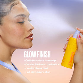 Urban Decay bottle in hand showing 4 fl oz size and travel-friendly benefit