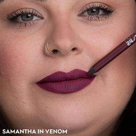 URBAN DECAY lip application in hand demonstrating easy lining and moisturizing benefit