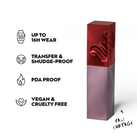 Urban Decay swatch on arm showing true merlot-red color payoff and one-swipe coverage