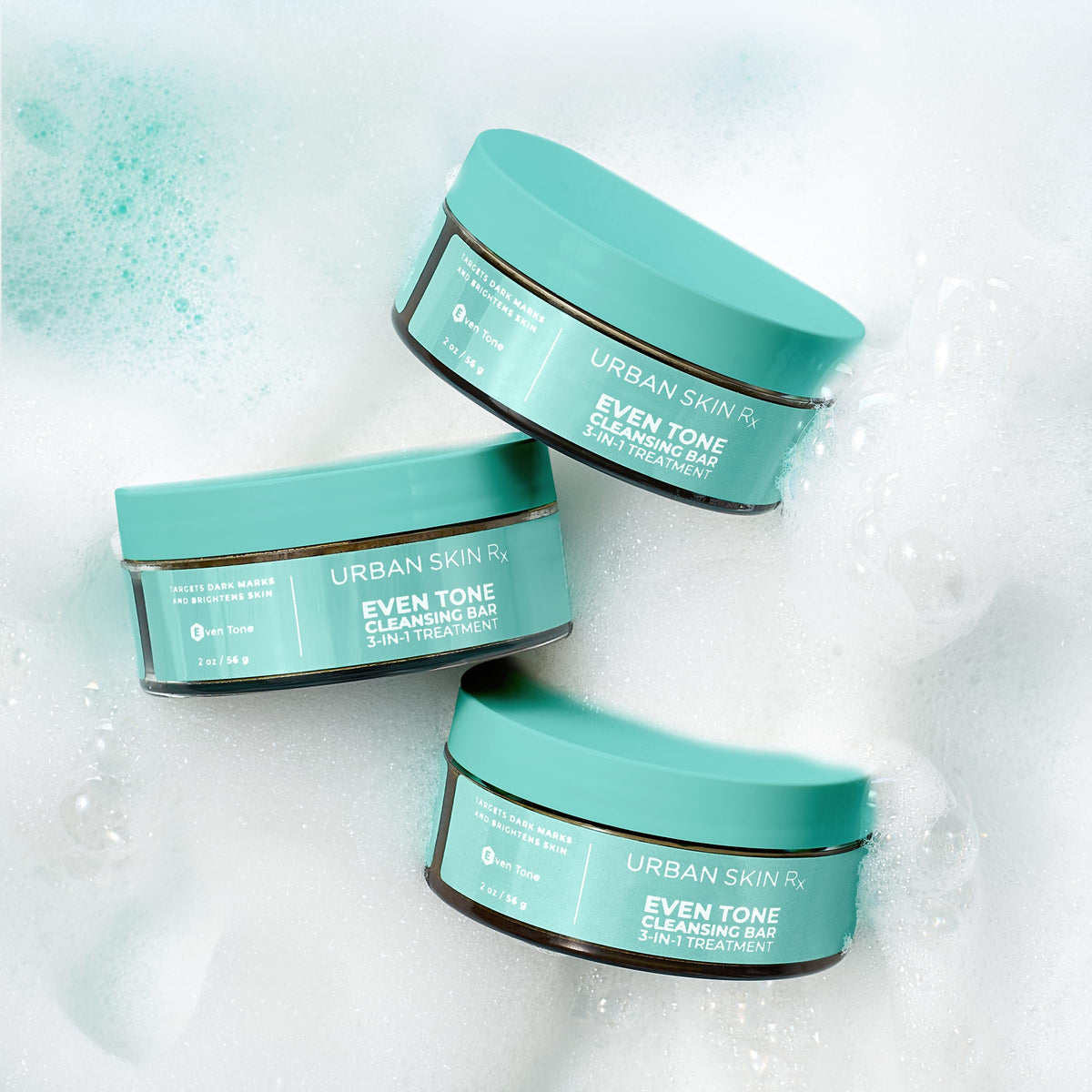 Urban Skin Rx bar next to a hand to show compact 2.0 oz travel-friendly size
