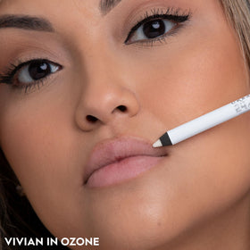 URBAN DECAY pencil being applied to lips showing ease of use and longwear benefit