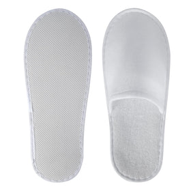 UrbanRoots slippers on hotel room floor conveying guest-ready comfort and professional presentation