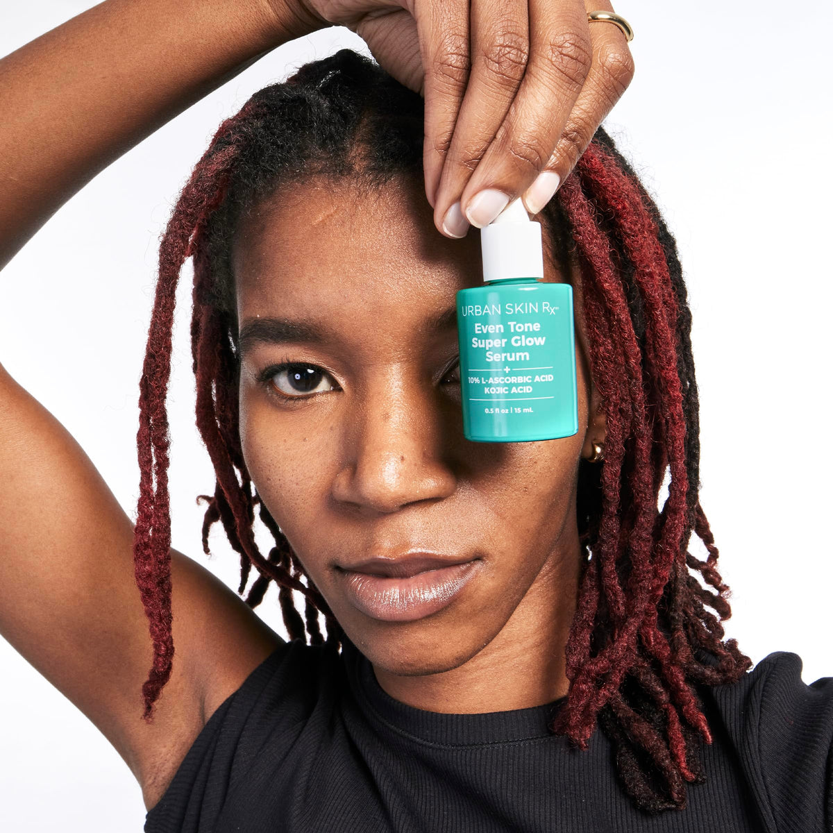 Urban Skin Rx serum applied on hand demonstrating smooth absorbency