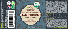 US Organic golden-orange oil drops showing smooth texture and nutrient-rich color