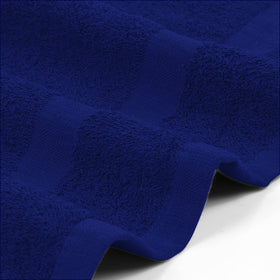 Utopia Towels being used to dry hair in a salon demonstrating quick absorbency