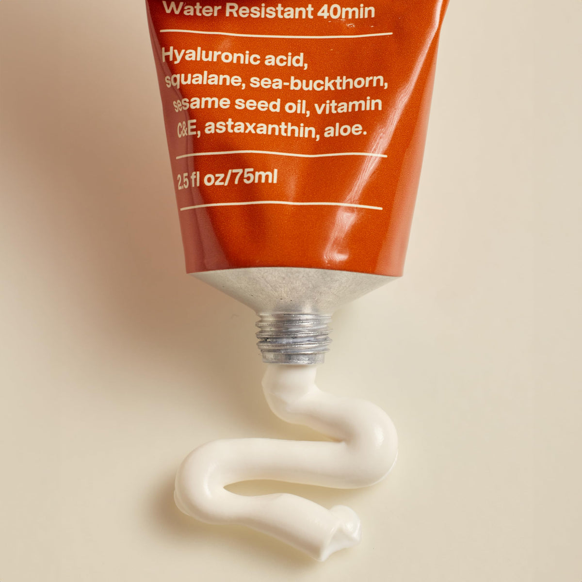 UTU next to credit card showing compact 20 mL travel-friendly size