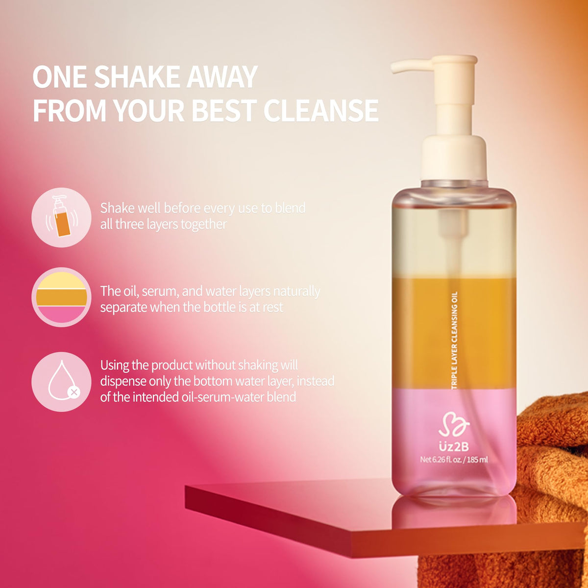 UZ2B three-layer closeup showing yellow oil, orange serum, pink water layers and visual clarity