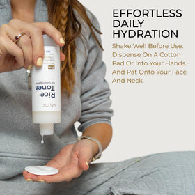 VALITIC rice toner 200ml beside a hand to show true size and travel-friendly capacity