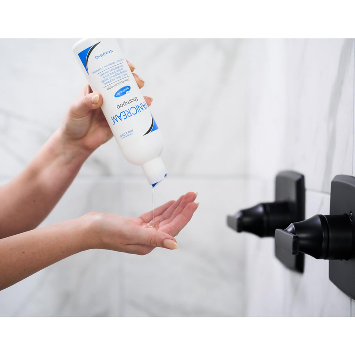 Vanicream conditioner being applied to hair ends to show lightweight hydration