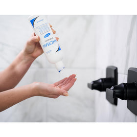 Vanicream conditioner being applied to hair ends to show lightweight hydration