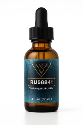 Person applying Vantanex RU-58841 to thinning scalp for targeted treatment