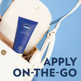 Applying Vaseline from tube to hands for targeted dry-skin relief