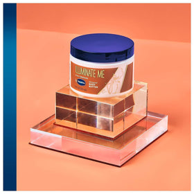 Vaseline jar open top view revealing light whipped body butter