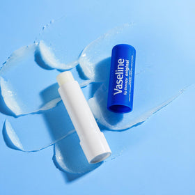Vaseline tube inside a purse lifestyle shot illustrating on-the-go relief