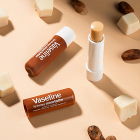 Vaseline jar next to bedside items showing nighttime repair routine