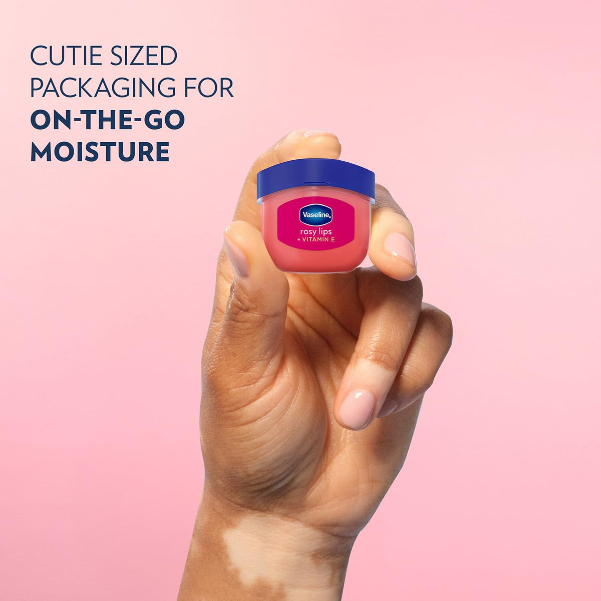Person applying Vaseline Rosy Lips for quick moisture and subtle color