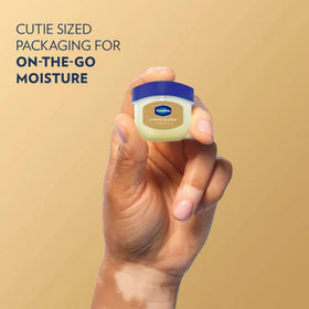 Vaseline rosy lips tint swipe revealing sheer pink color and subtle shine