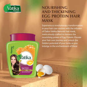 Vatika Naturals applying mask to damp hair demonstrating deep conditioning