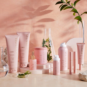 VEGAMOUR citrus and plant ingredients flatlay emphasizing fresh scent benefit