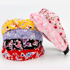 VELSCRUN headband held in hand to show size and one-size fit benefit
