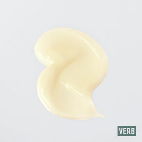 VERB curl cream being applied to damp curls for defined, frizz-free shape