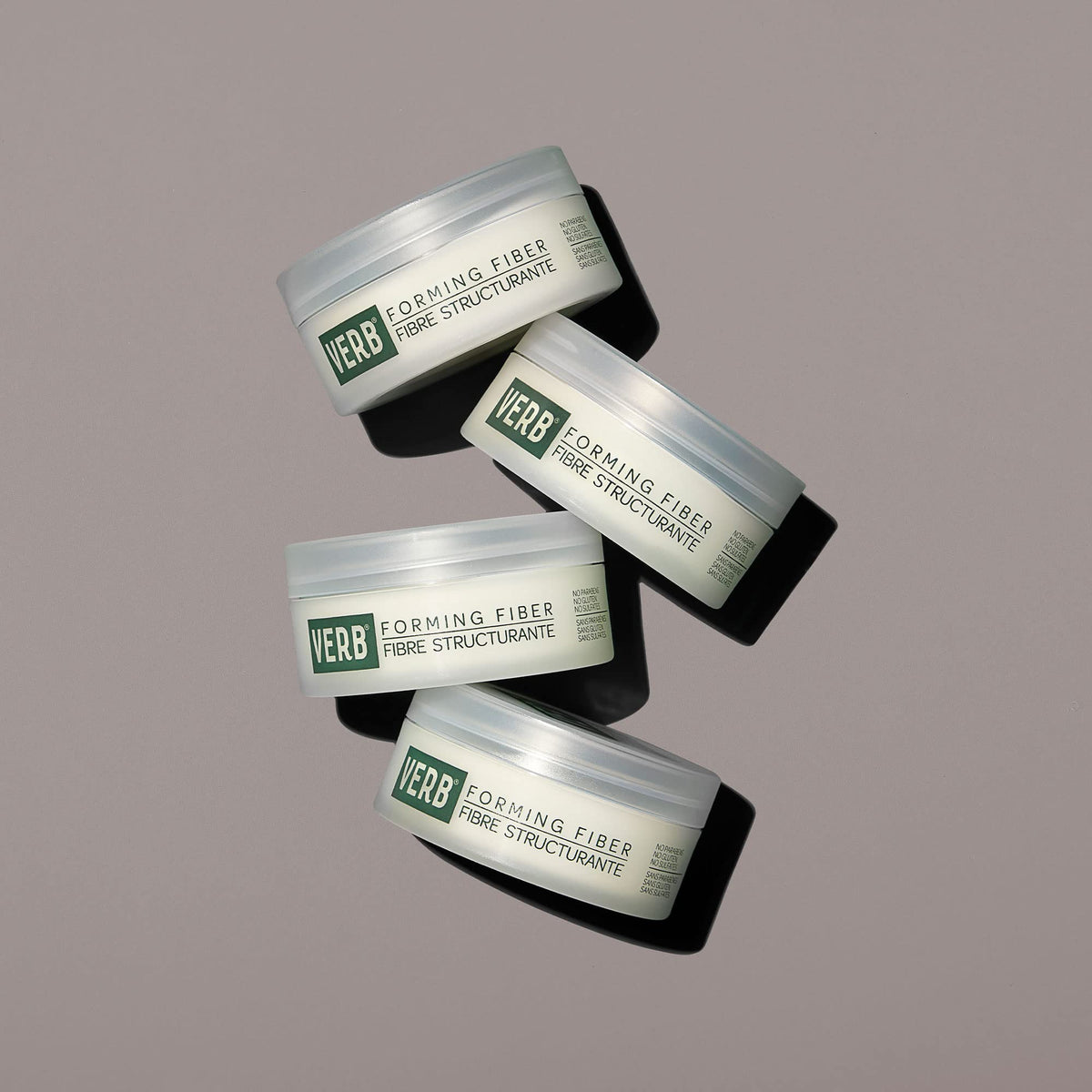 VERB applying product to hands demonstrates easy emulsifying and styling control benefit