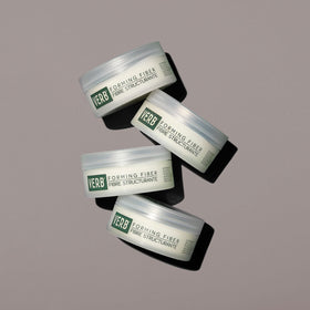 VERB applying product to hands demonstrates easy emulsifying and styling control benefit