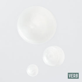 VERB Ghost duo bottle scale placed next to hand to show 32 fl oz size