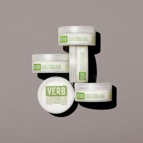 VERB sculpting clay next to everyday items to show 2 oz size and portability