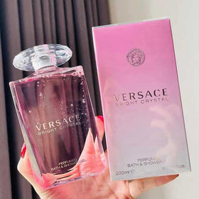 Versace Bright Crystal in shower being applied with a loofah, demonstrates hydrated skin benefit