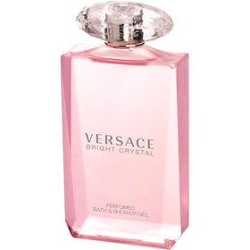 Versace Bright Crystal next to a hand for scale showing 6.7 oz size, easy travel-friendly
