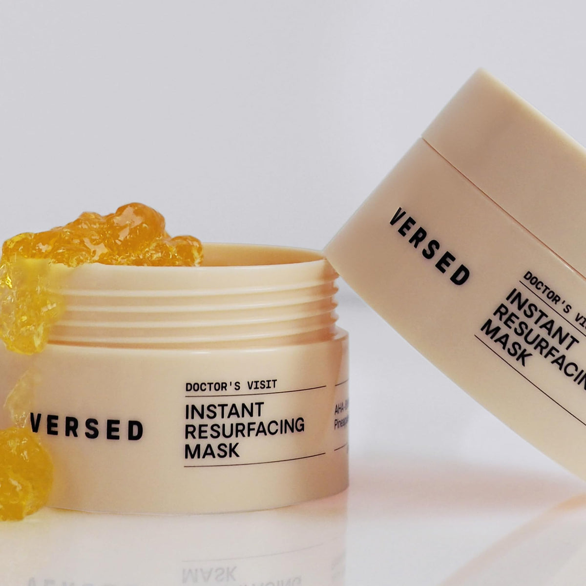 Versed tube next to hand to show 1.7 fl oz size and portability