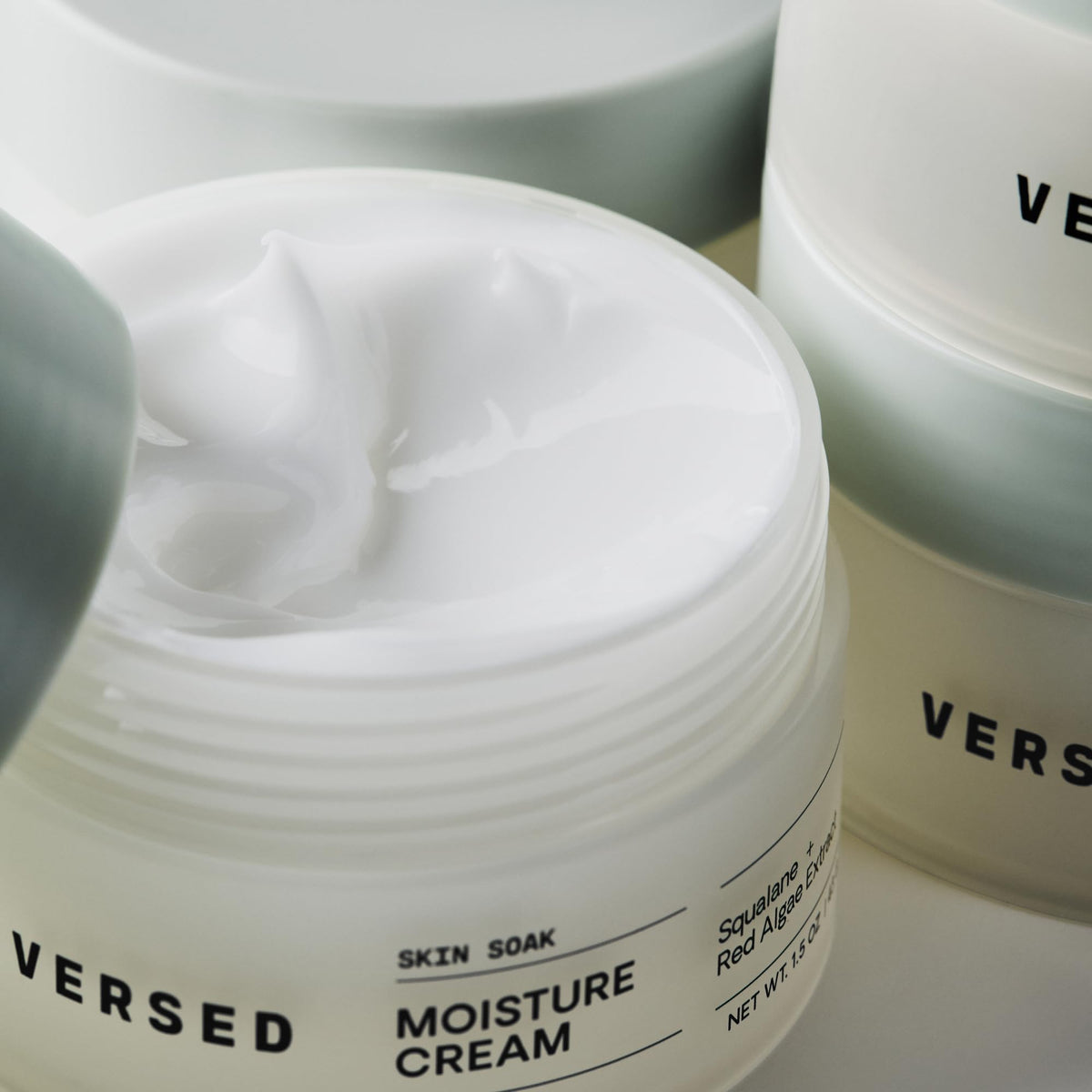 Versed jar in hand demonstrating easy application and quick absorption