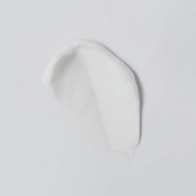 Versed cream texture close-up illustrating lightweight, cushiony finish