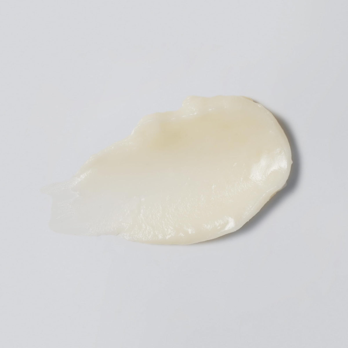 Versed balm texture closeup displaying smooth, cushiony finish and hydrating look