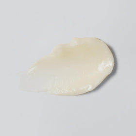 Versed balm texture closeup displaying smooth, cushiony finish and hydrating look