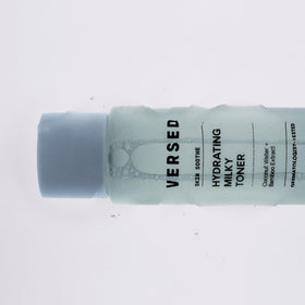Versed toner in hand being applied to skin for quick-absorbing hydration