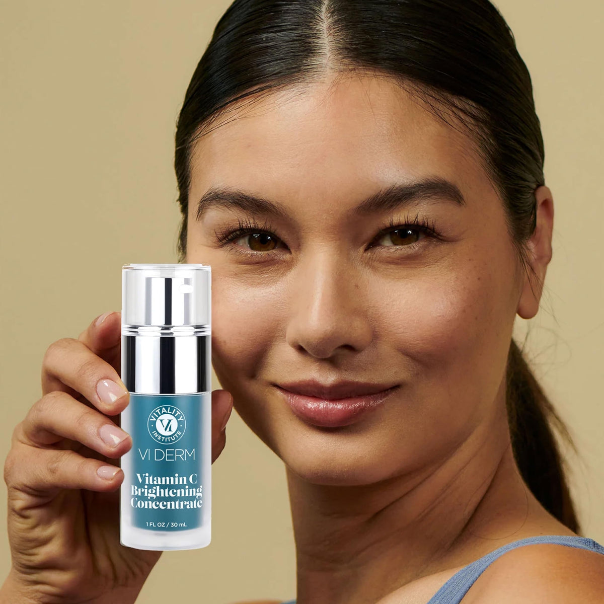 VI DERM serum applied to skin in morning routine showing brightening support benefit