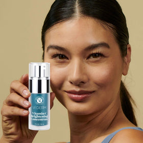 VI DERM serum applied to skin in morning routine showing brightening support benefit
