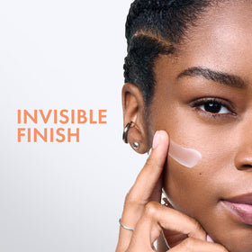 Vichy application to cheek demonstrating invisible finish and layering benefit