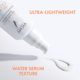 Vichy tube beside hand for scale showing travel-friendly daily protection