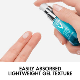 Applying VICHY eye serum with fingers for fast absorption and de-puffing