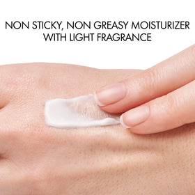 VICHY cream on hand scale illustrating lightweight, non-greasy feel