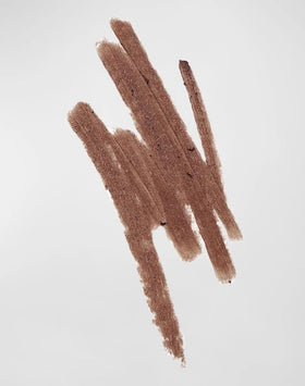 Victoria Beckham cinnamon swatch on arm showing rich pigment and blendable texture benefit